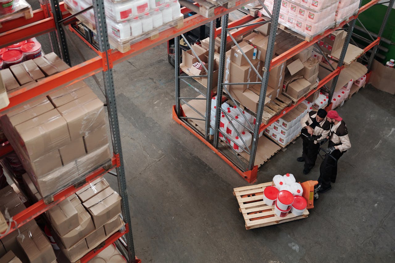 The Art of Drawing Readers In: Your attractive post title goes here Workers managing inventory on shelves in a warehouse, viewed from above.